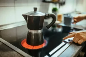 moka pot on stovetop to make a latte