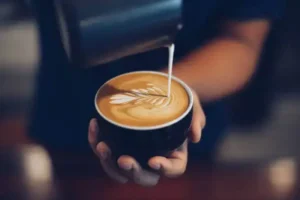 whisking the milk for delicious coffee